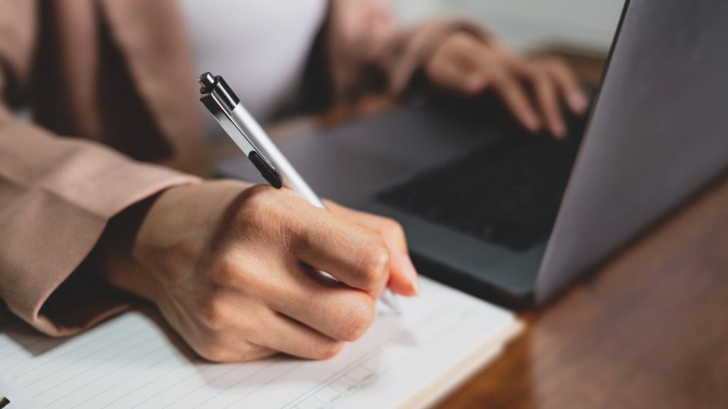 Digital marketing strategy for small business planning session with laptop and notes